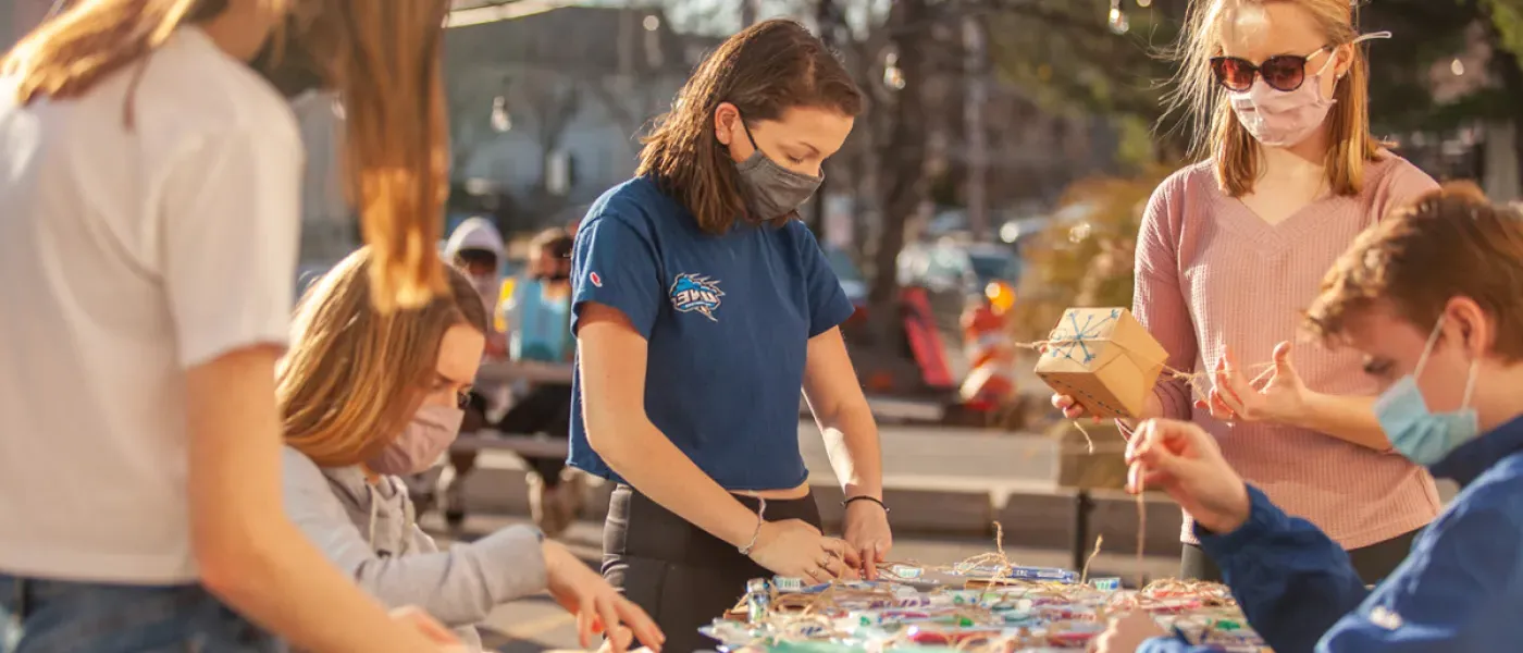 Students prepare to put string lights up around downtown Biddeford, Maine